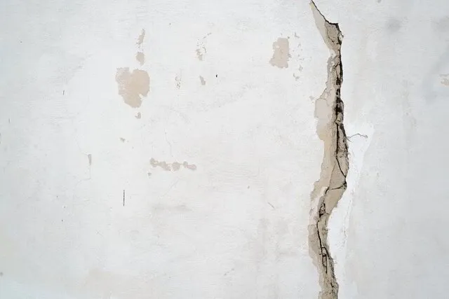 Structural drywall damage — cracked and damaged wall in Michigan home